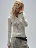 Abstract Print Ribbed Knit Half-Zip Sweater