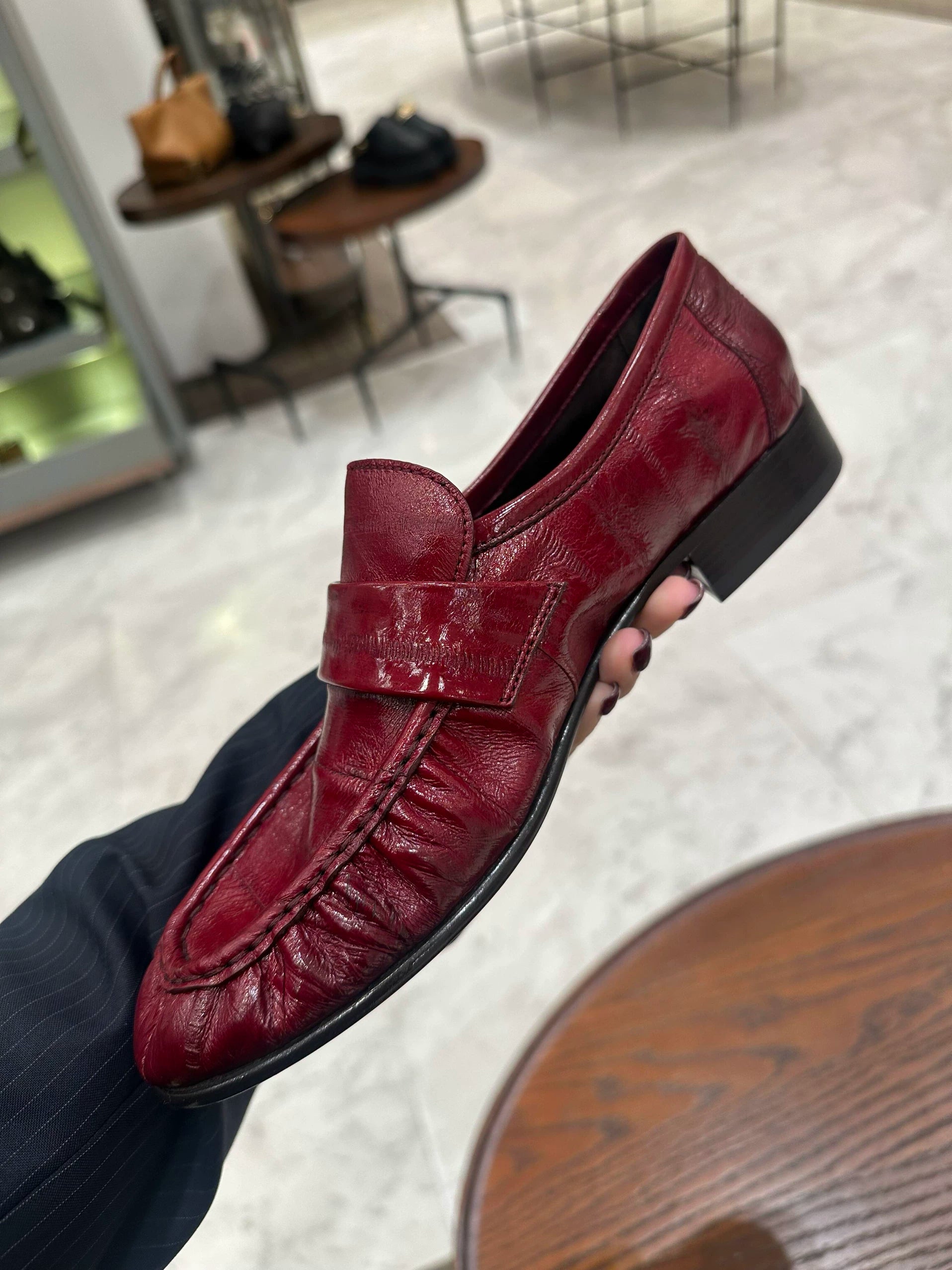 Bordeaux ruched eel leather loafers — angled profile