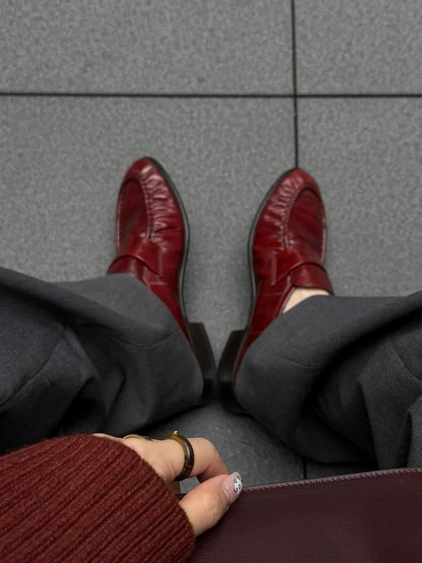 Bordeaux ruched eel leather loafers — worn, top view