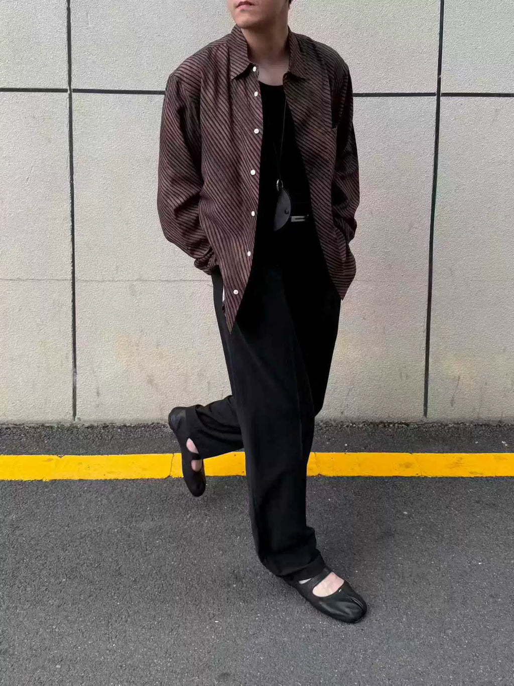 Umber wave-stripe fluid shirt — styled with black trousers, alternate look