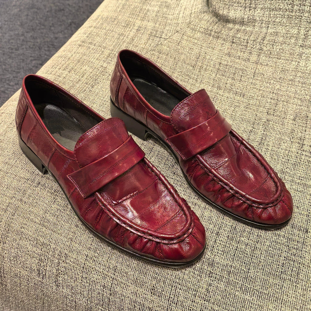 Bordeaux ruched eel leather loafers — flat lay