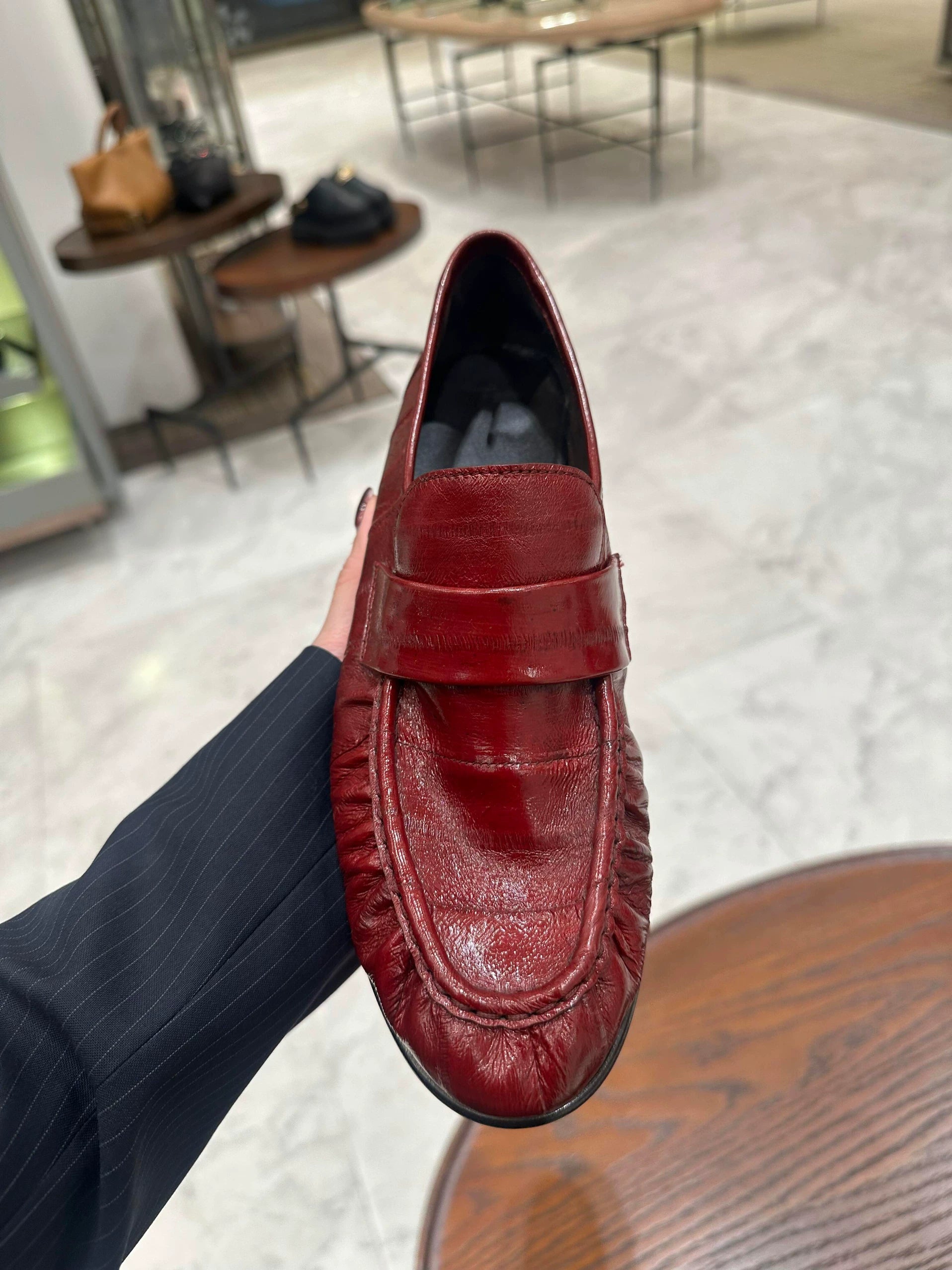 Bordeaux ruched eel leather loafers — top-down detail of ruched moc toe