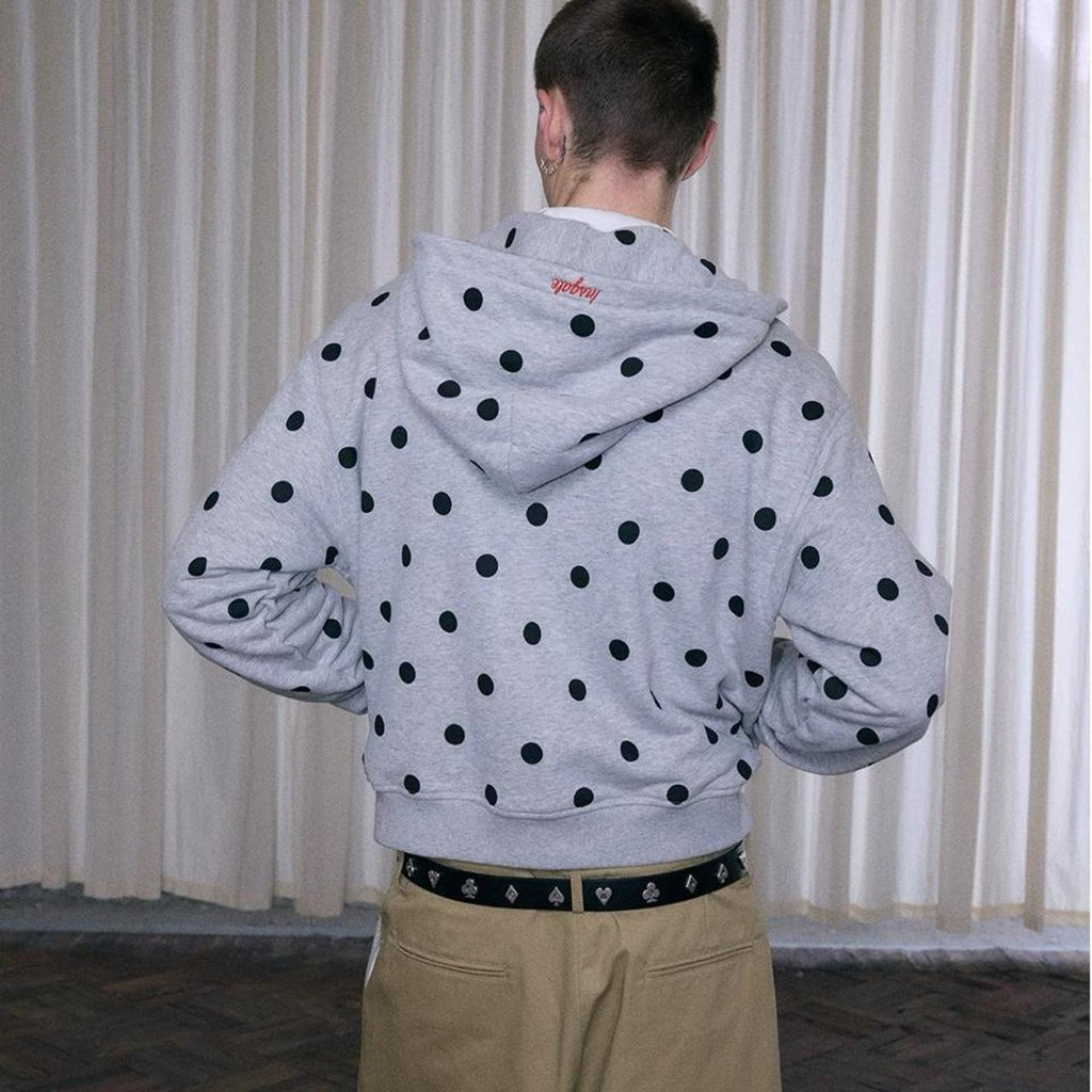 Gray zip up hoodie with black polka dots