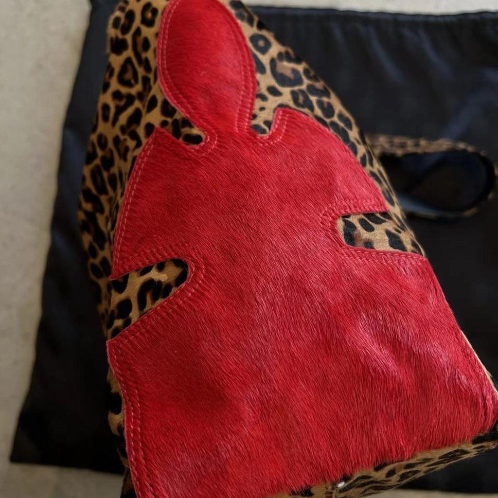 Leopard print cross purse with red cross appliqué